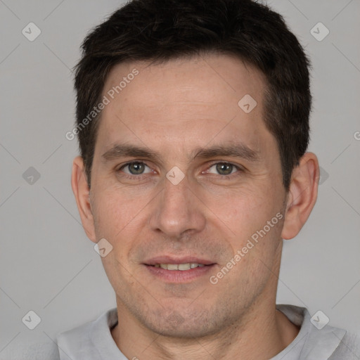 Joyful white adult male with short  brown hair and brown eyes