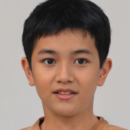 Joyful asian child male with short  black hair and brown eyes