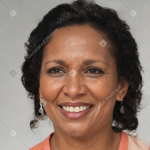 Joyful latino adult female with medium  brown hair and brown eyes