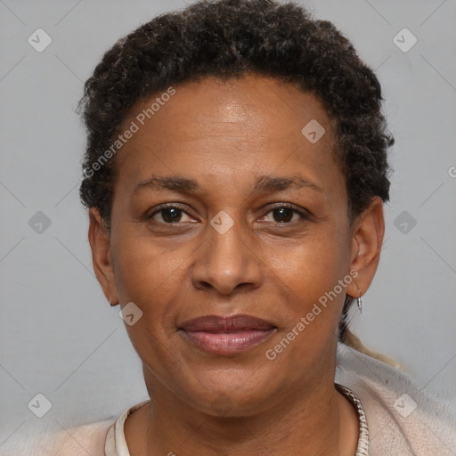 Joyful black adult female with short  brown hair and brown eyes