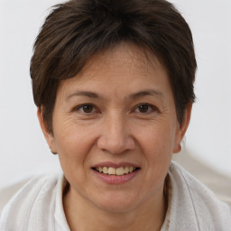 Joyful white adult female with short  brown hair and brown eyes