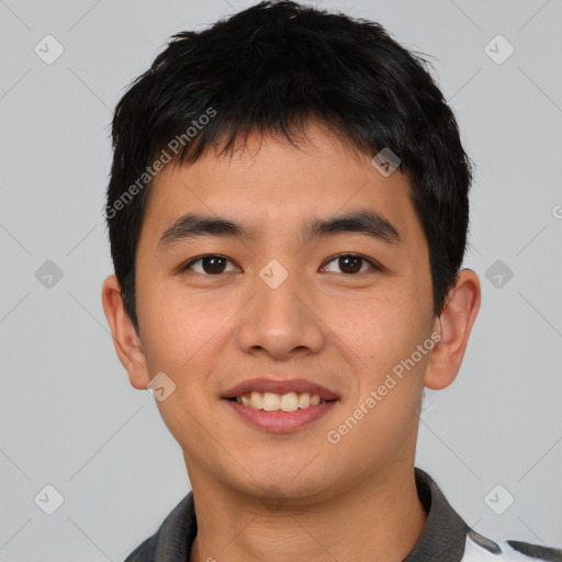 Joyful asian young-adult male with short  black hair and brown eyes