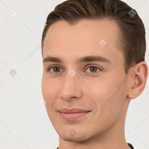 Joyful white young-adult male with short  brown hair and brown eyes