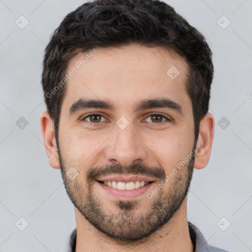 Joyful white young-adult male with short  black hair and brown eyes