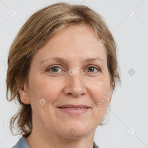 Joyful white adult female with medium  brown hair and grey eyes