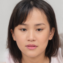 Neutral asian young-adult female with medium  brown hair and brown eyes