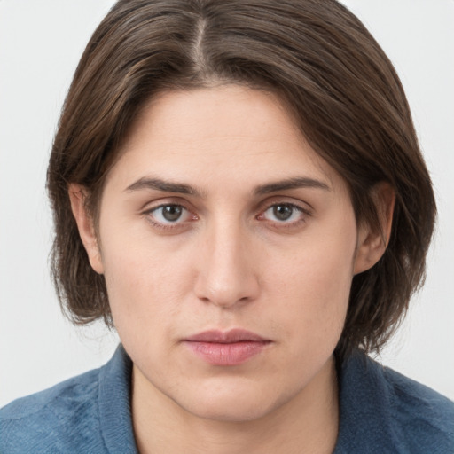 Neutral white young-adult female with medium  brown hair and grey eyes