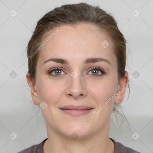 Joyful white young-adult female with medium  brown hair and grey eyes