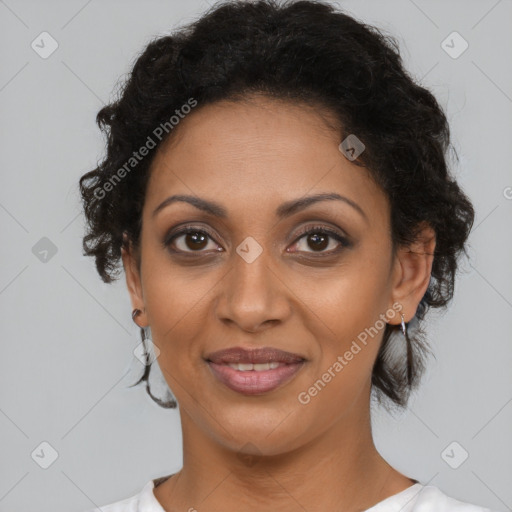 Joyful black young-adult female with short  brown hair and brown eyes