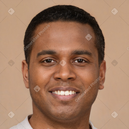 Joyful latino young-adult male with short  brown hair and brown eyes