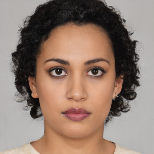 Neutral latino young-adult female with medium  black hair and brown eyes