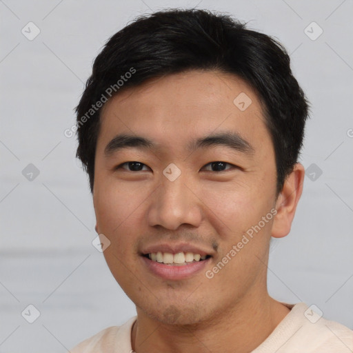 Joyful asian young-adult male with short  black hair and brown eyes