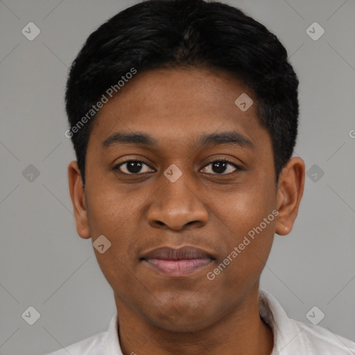 Joyful black young-adult male with short  black hair and brown eyes