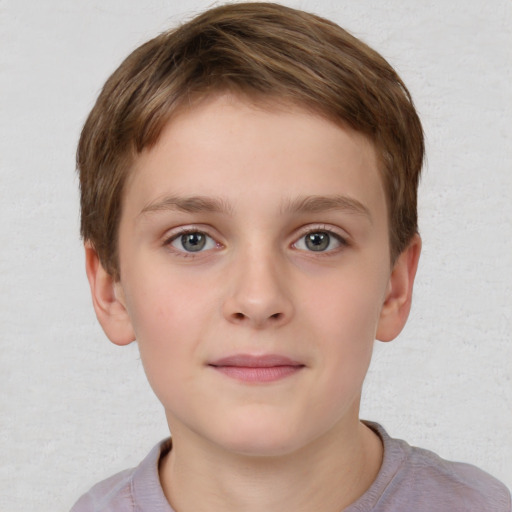 Joyful white child male with short  brown hair and grey eyes