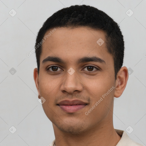 Joyful latino young-adult male with short  black hair and brown eyes