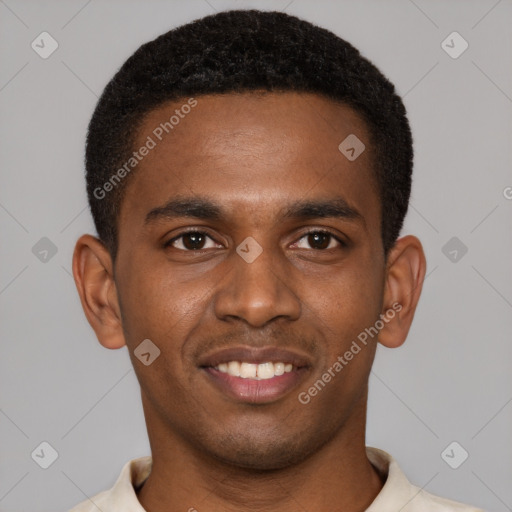 Joyful black young-adult male with short  brown hair and brown eyes