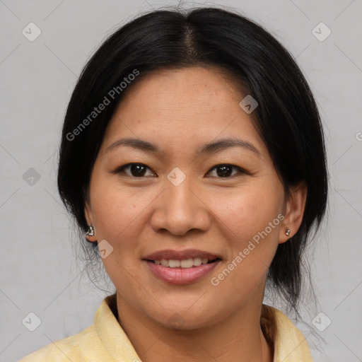 Joyful asian young-adult female with medium  black hair and brown eyes