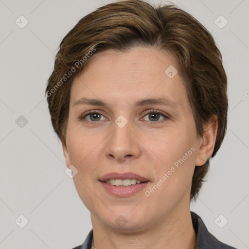 Joyful white adult female with short  brown hair and grey eyes