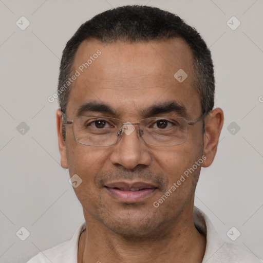 Joyful white adult male with short  black hair and brown eyes