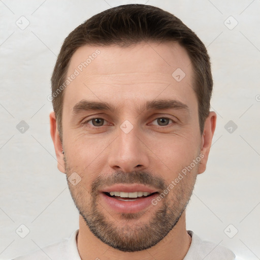 Joyful white young-adult male with short  brown hair and brown eyes