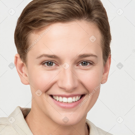 Joyful white young-adult female with short  brown hair and grey eyes