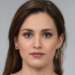 Neutral white young-adult female with medium  brown hair and brown eyes