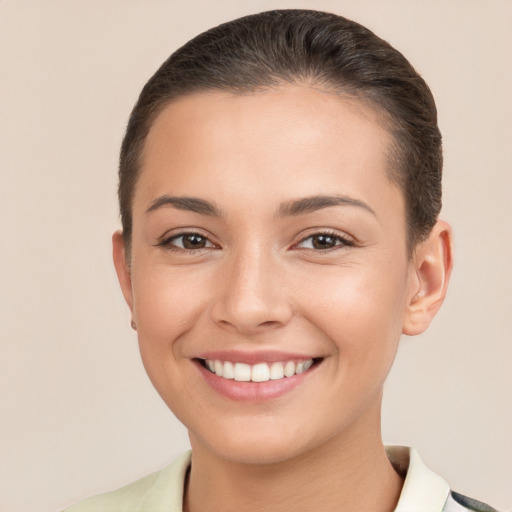 Joyful white young-adult female with short  brown hair and brown eyes