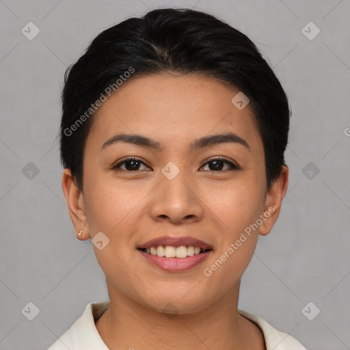 Joyful asian young-adult female with short  brown hair and brown eyes