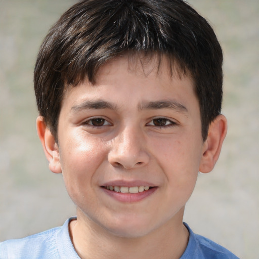 Joyful white child male with short  brown hair and brown eyes