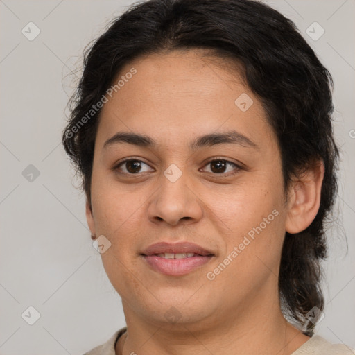 Joyful latino young-adult female with medium  brown hair and brown eyes