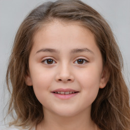 Joyful white child female with medium  brown hair and brown eyes