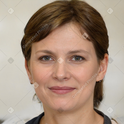 Joyful white adult female with medium  brown hair and brown eyes