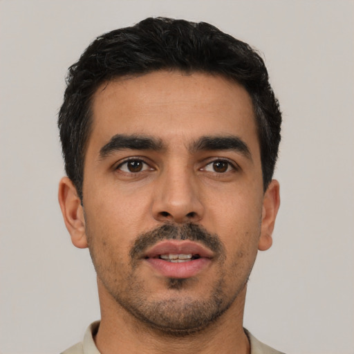 Neutral latino young-adult male with short  black hair and brown eyes