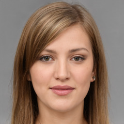 Joyful white young-adult female with long  brown hair and grey eyes