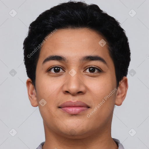 Joyful latino young-adult male with short  black hair and brown eyes