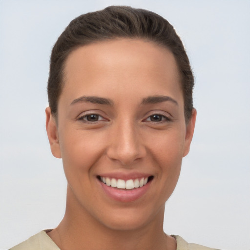 Joyful white young-adult female with short  brown hair and brown eyes