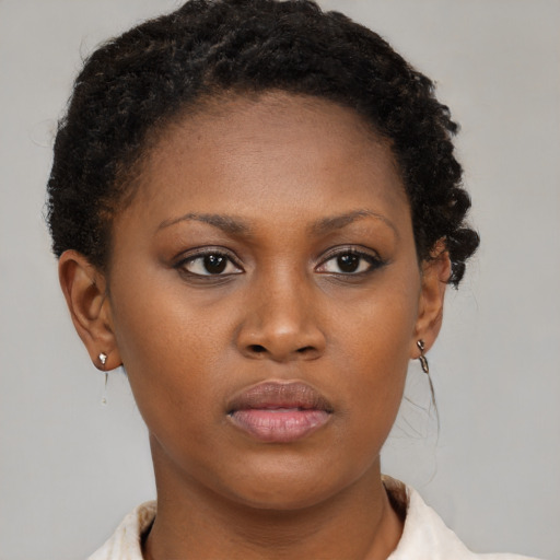 Neutral black young-adult female with short  brown hair and brown eyes