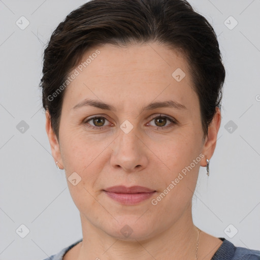 Joyful white adult female with short  brown hair and brown eyes