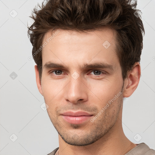 Neutral white young-adult male with short  brown hair and brown eyes