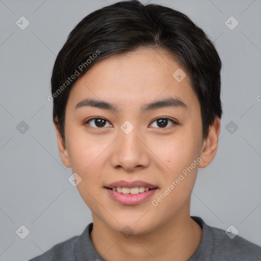 Joyful asian young-adult female with short  black hair and brown eyes