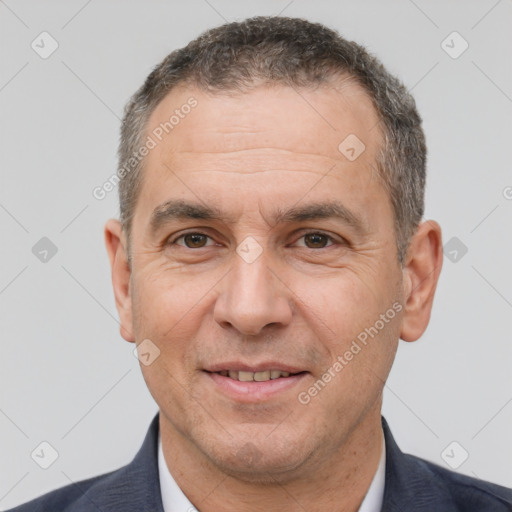 Joyful white adult male with short  brown hair and brown eyes