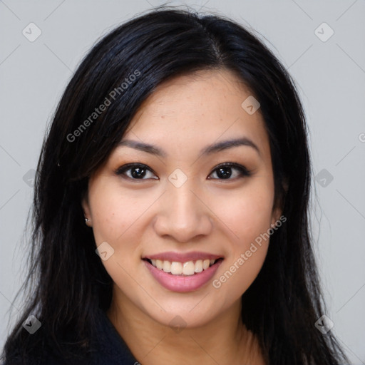 Joyful asian young-adult female with long  black hair and brown eyes