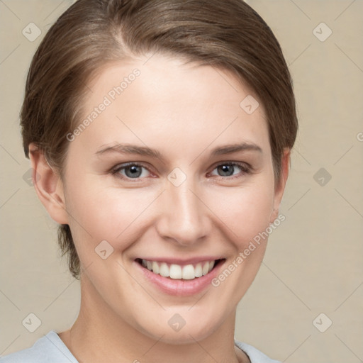 Joyful white young-adult female with short  brown hair and grey eyes