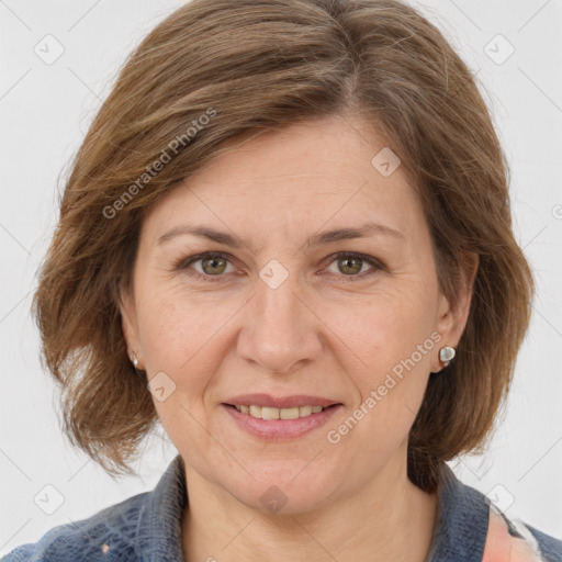 Joyful white adult female with medium  brown hair and grey eyes