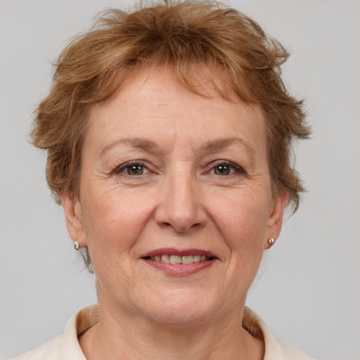 Joyful white middle-aged female with short  brown hair and brown eyes