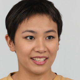 Joyful asian young-adult female with short  brown hair and brown eyes