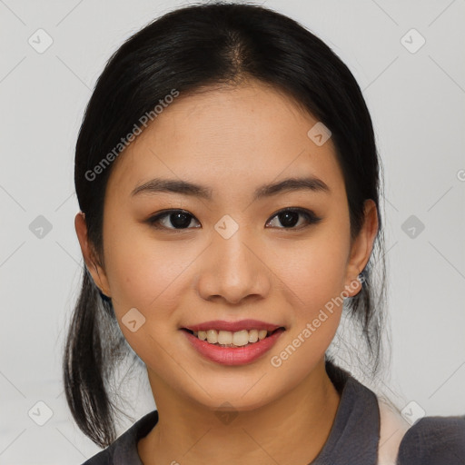 Joyful asian young-adult female with medium  black hair and brown eyes