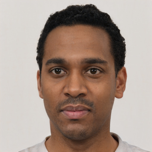 Neutral black young-adult male with short  black hair and brown eyes