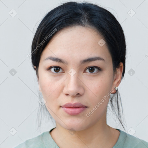 Joyful asian young-adult female with medium  black hair and brown eyes