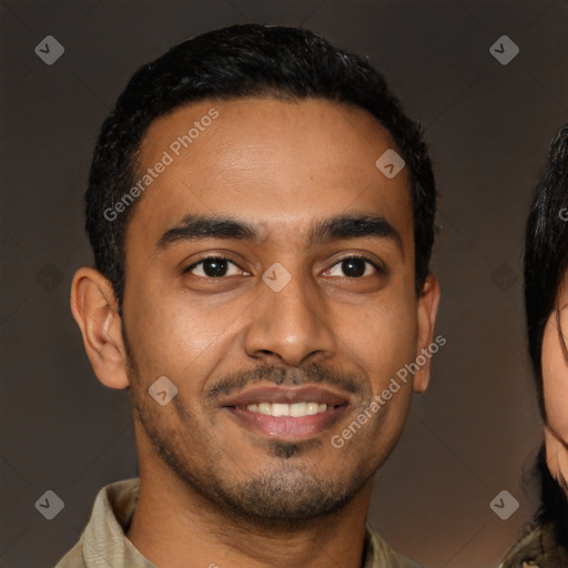 Joyful latino young-adult male with short  brown hair and brown eyes